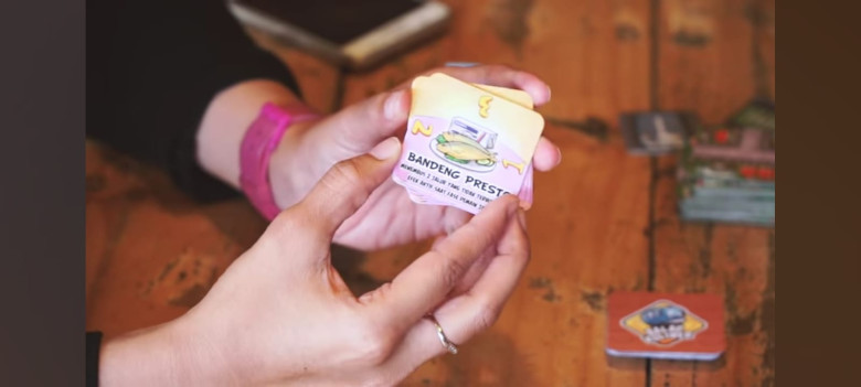 4.	Kocok kartu jajanan dengan terbuka dan tempatkan ditengah papan permainan.